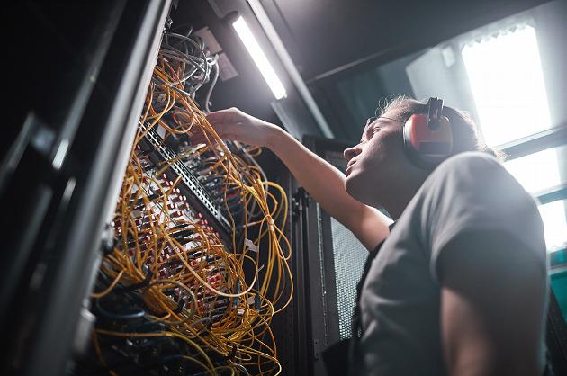 Man repairing network data centre